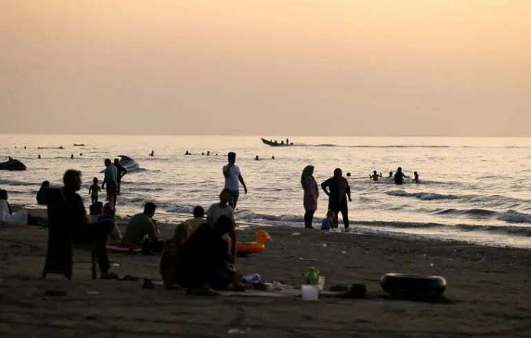This photo, taken in 2021, shows Iranians on a beach in the Caspian Sea port city of Mahmoud Abad