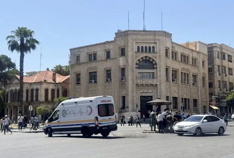 Explosive devices blow up near a hotel where French President Emmanuel Macron was meant to be staying, in Damascus